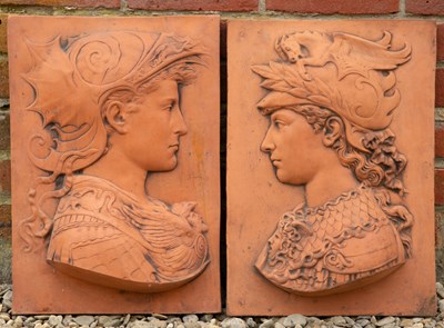 Lot 825 - A pair of terracotta coloured cast plaques...