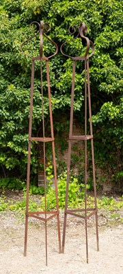 Lot 828 - A pair of wrought iron garden stands or...