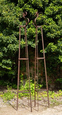 Lot 829 - A pair of wrought iron garden stands or...