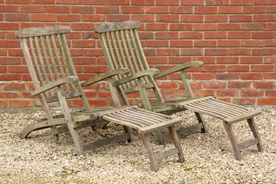 Lot 830 - A pair of teak and brass reclining steamer...