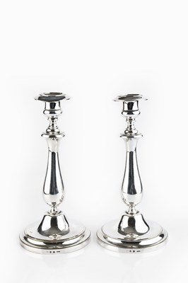 Lot 395 - A pair of French silver plated candlesticks,...