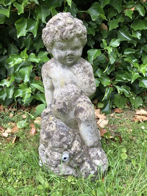 Lot 701 - A small reconstituted stone fountain head in...