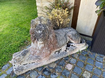 Lot 839 - A pair of large composite stone recumbent lion...