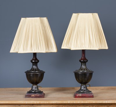 Lot 216 - A pair of cast and painted metal table lamps...