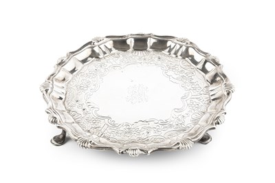 Lot 397 - A George II silver waiter, with shaped and...