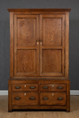 Lot 403 - A Georgian elm linen press with twin panelled...