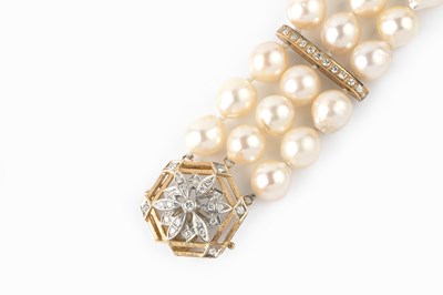 Lot 56 - A cultured pearl and diamond bracelet,...