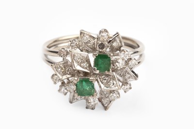 Lot 114 - An emerald and diamond dress ring, designed as...