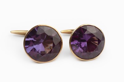 Lot 35 - A pair of gem set cufflinks, the circular...