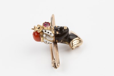 Lot 25 - An enamel and gem set blackamoor bar brooch,...
