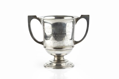 Lot 407 - A George V silver twin handled trophy cup,...