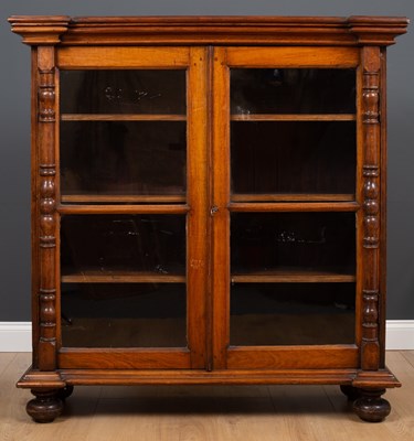 Lot 240 - An antique rosewood glazed two door display...