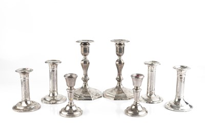 Lot 419 - A matched pair of silver candlesticks, of...