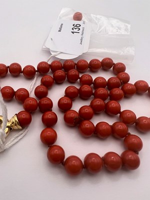 Lot 136 - A coral bead necklace, comprising a single...