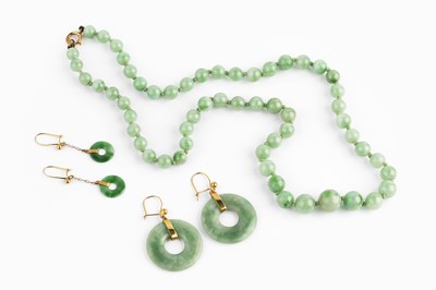 Lot 39 - A collection of jade jewellery, comprising a...