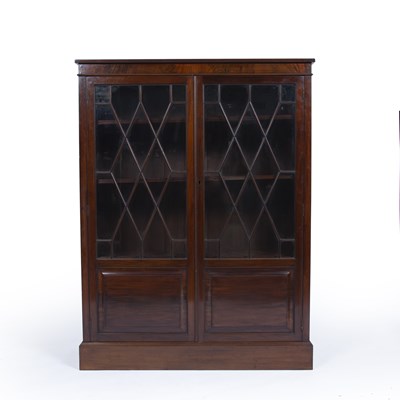 Lot 22 - Attributed to Heals mahogany glazed bookcase,...