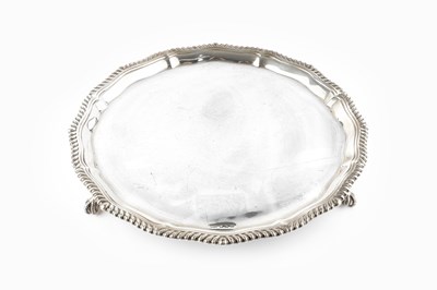 Lot 495 - An Edwardian silver salver, with shaped and...