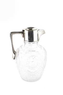 Lot 500 - A George V silver mounted cut glass claret jug,...