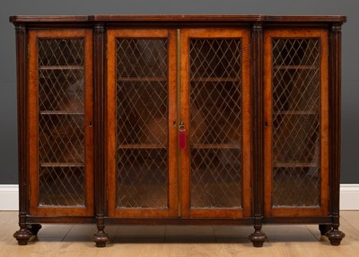 Lot 185 - A 19th century mahogany breakfront bookcase...