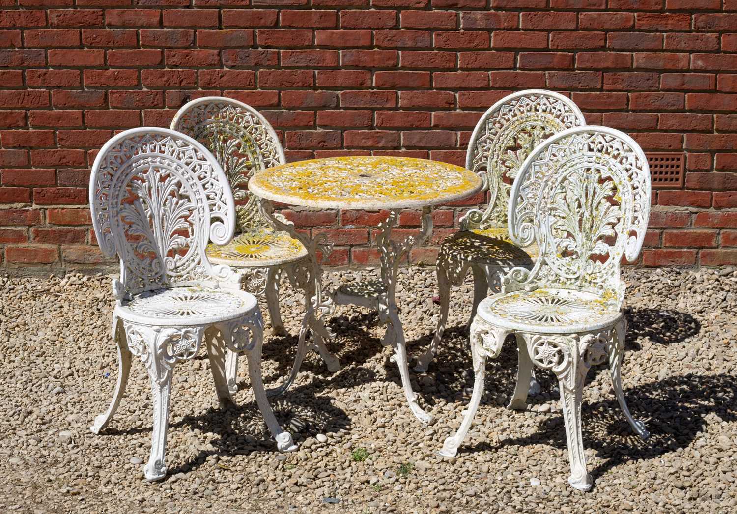 Lot 706 - A cast aluminium garden table and four...