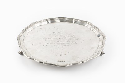 Lot 502 - A silver salver, with shaped border, on scroll...