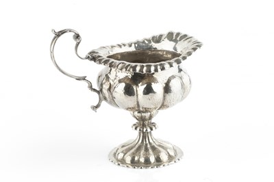 Lot 477 - An Edwardian silver cream jug, of Georgian...