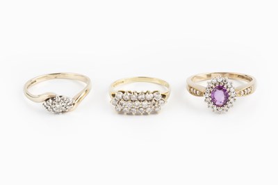 Lot 41 - A pink sapphire and diamond cluster ring, the...