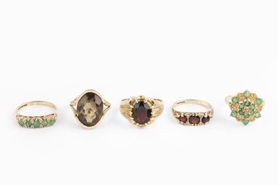 Lot 95 - Five gem set dress rings, comprising a garnet...