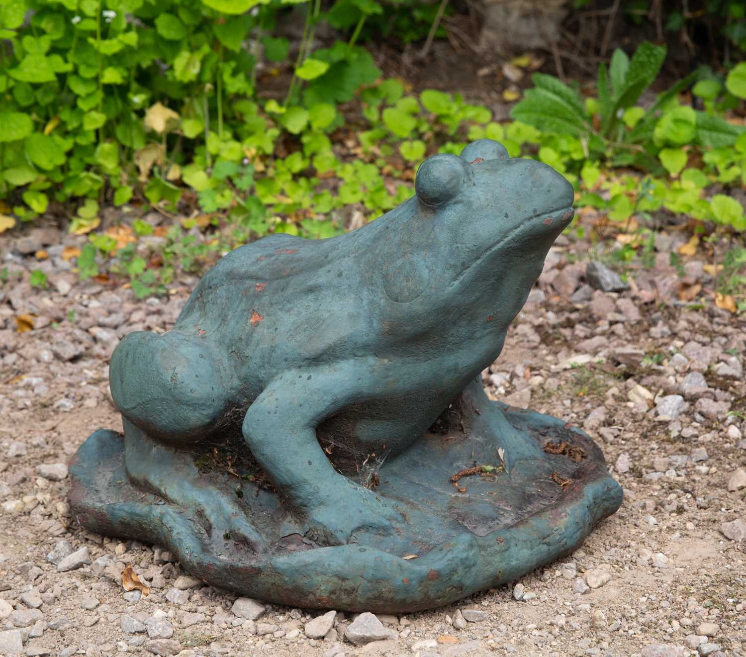 Lot 707 - A green painted cast iron frog on a lily leaf,...