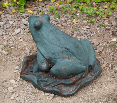 Lot 707 - A green painted cast iron frog on a lily leaf,...