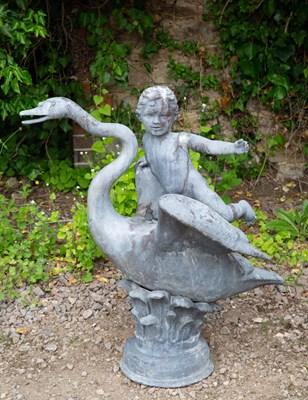 Lot 708 - A lead fountain in the form of a boy riding on...