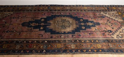 Lot 1059 - An Eastern blue and brown ground carpet