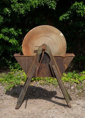 Lot 710 - An antique grinding wheel the sandstone wheel...