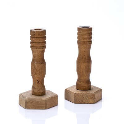 Lot 11 - Cotswold school pair of oak candlesticks,...