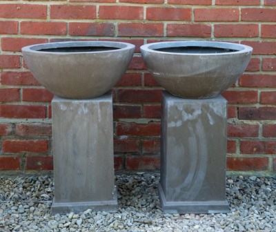 Lot 724 - A pair of fibre clay bowls on plinth bases,...