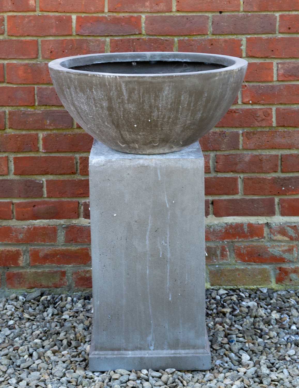 Lot 723 - A circular fibre clay bowl on a square plinth...