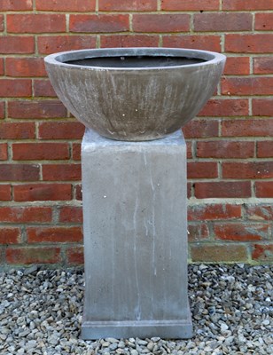 Lot 723 - A circular fibre clay bowl on a square plinth...