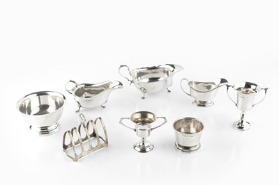 Lot 516 - A collection of silver, comprising a sauce...