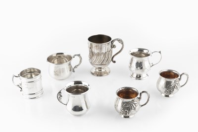 Lot 517 - An Edwardian silver christening mug, with part...