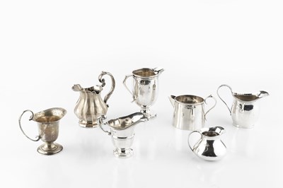 Lot 521 - A silver cream jug, with reeded borders and...