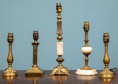 Lot 102 - A collection of brass lamp bases, together...