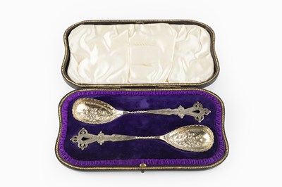 Lot 555 - A pair of late Victorian silver berry spoons,...