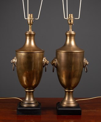 Lot 204 - A pair of cast brass table lamps of urn form...