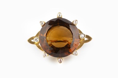 Lot 54 - A citrine and diamond brooch, the circular...