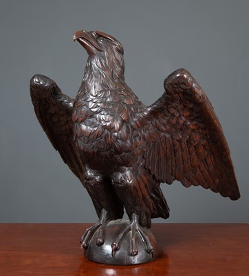 Lot 154 - An antique carved oak dark stained eagle 61cm...