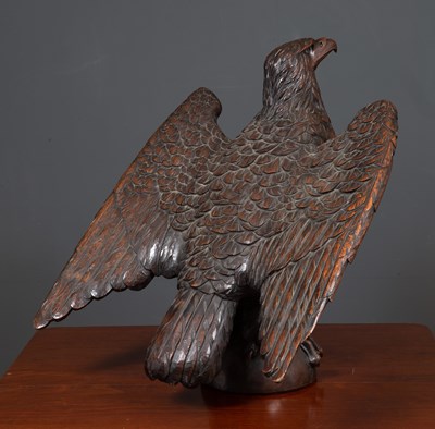 Lot 154 - An antique carved oak dark stained eagle 61cm...
