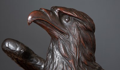 Lot 154 - An antique carved oak dark stained eagle 61cm...