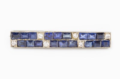 Lot 109 - A sapphire and diamond bar brooch, designed as...