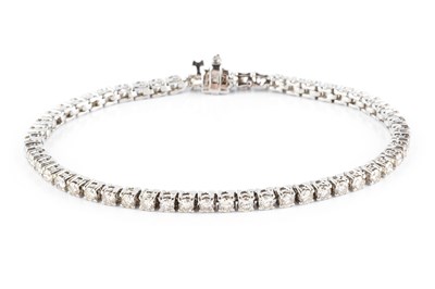 Lot 144 - A diamond line bracelet, designed as a series...