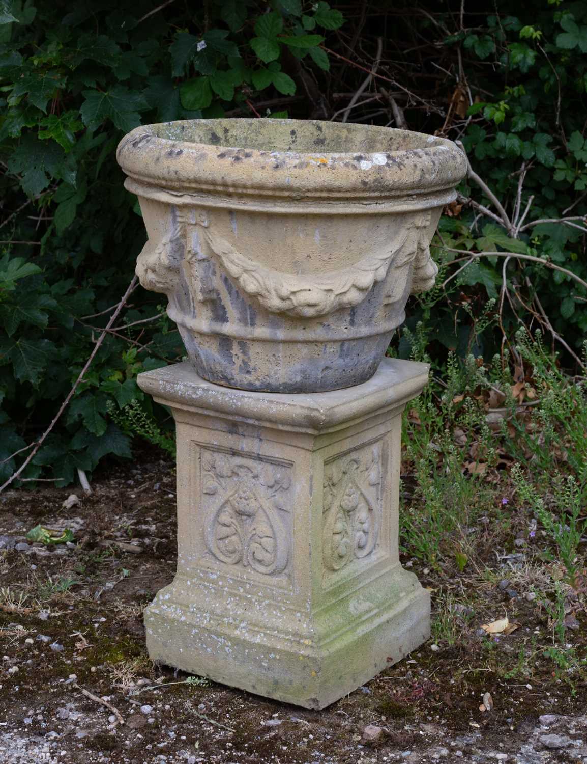 Lot 737 - A composite stone urn, 48cm diameter x 36cm...